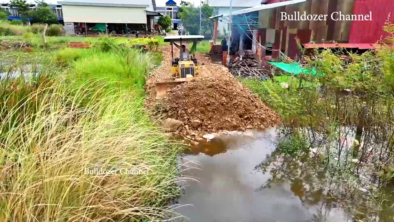Building Foundation New Road Village By Dozer Working Pushing & Stone - Dump Truck Unloading Stone