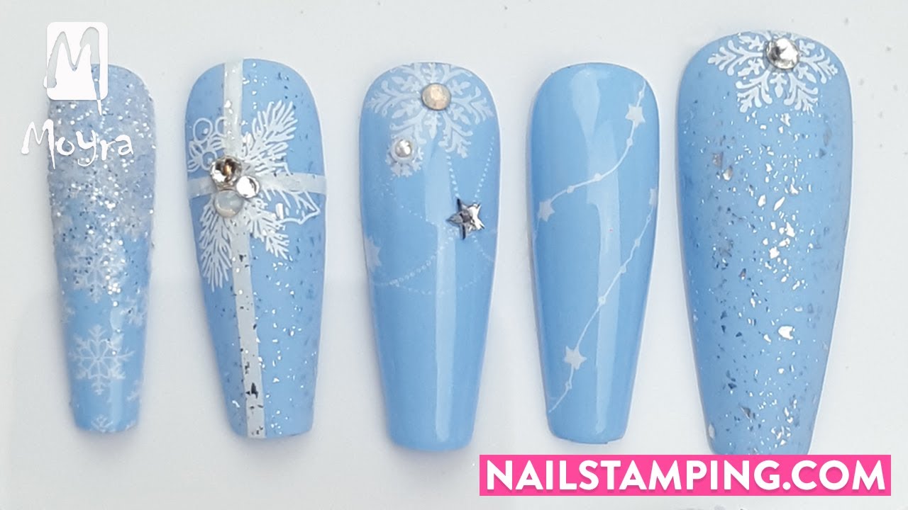 Festive nail art on light blue base (nailstamping.com)
