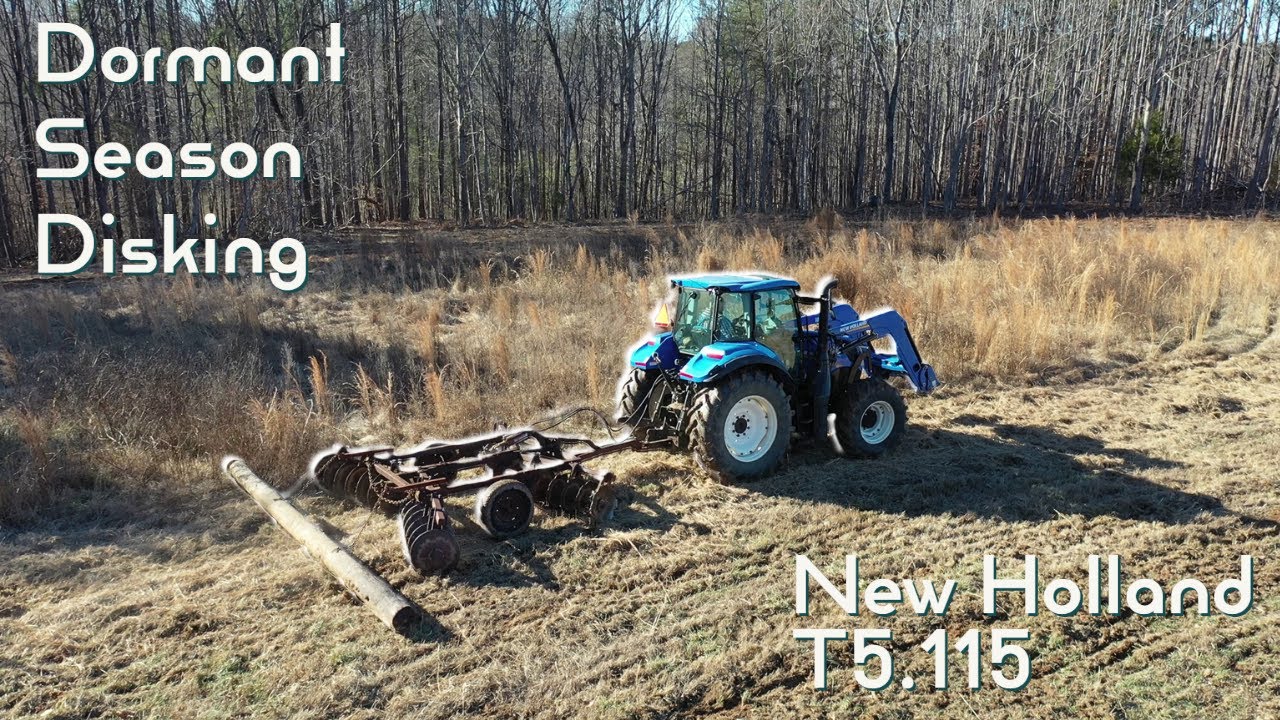 Discing a CRP field with the New Holland T5.120