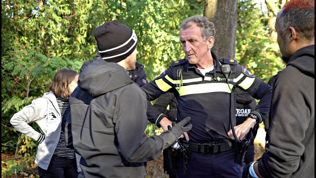 Police Officer Faces Off with Vegan Activist