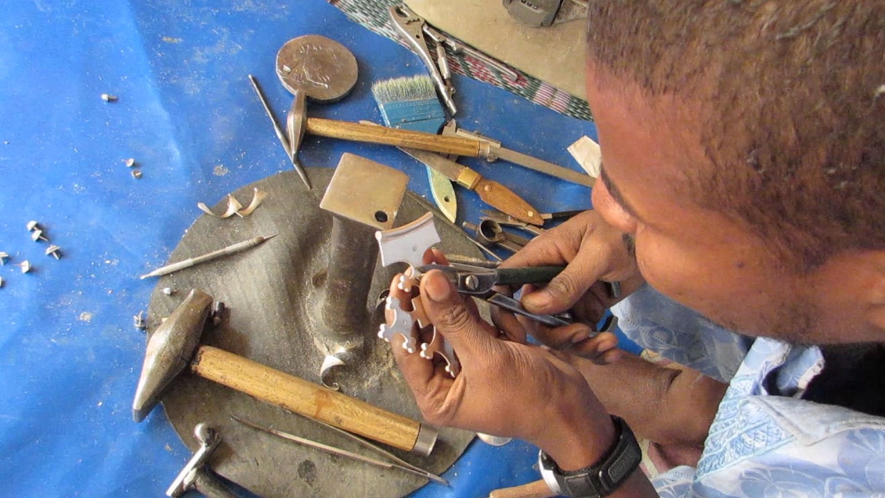 Tuareg silver smith making a cross in Agadez, Niger