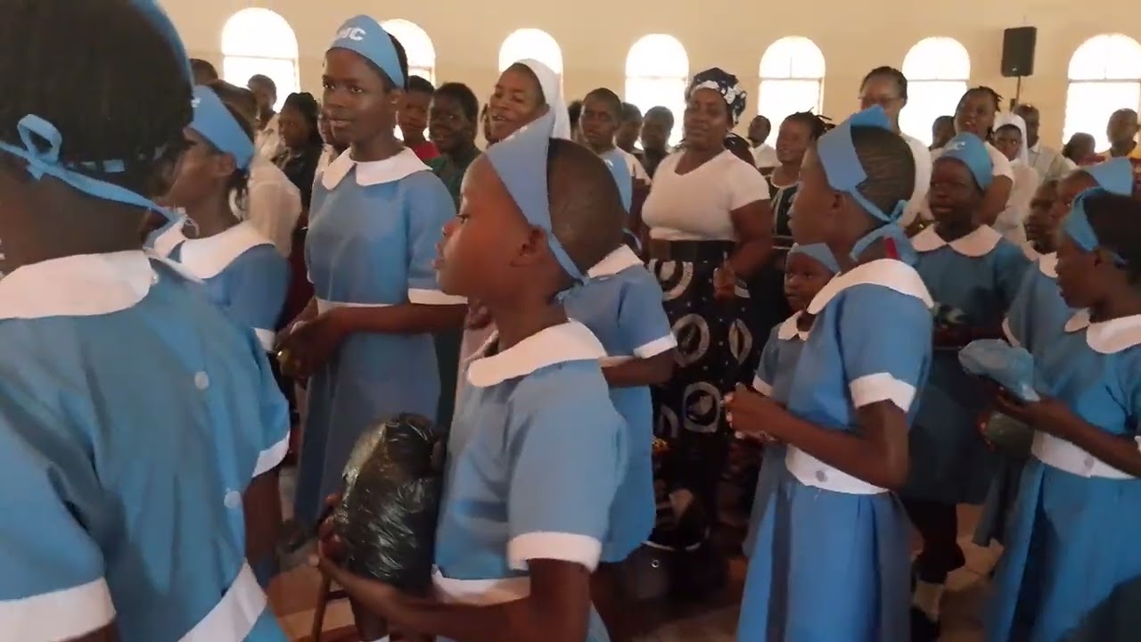 Missionary Childhood Association members presenting gifts