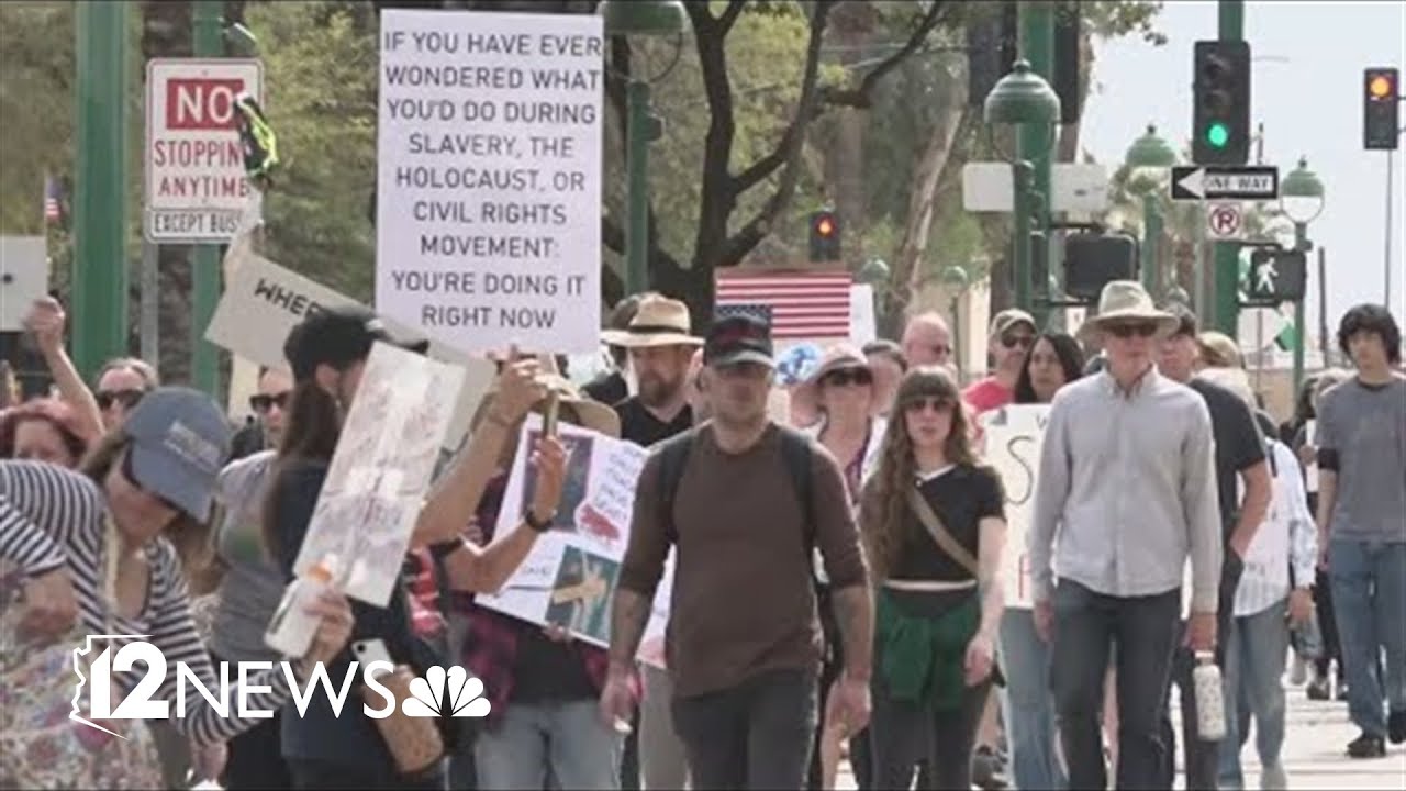 Large group protests immigration policies, Elon Musk at Arizona State Capitol