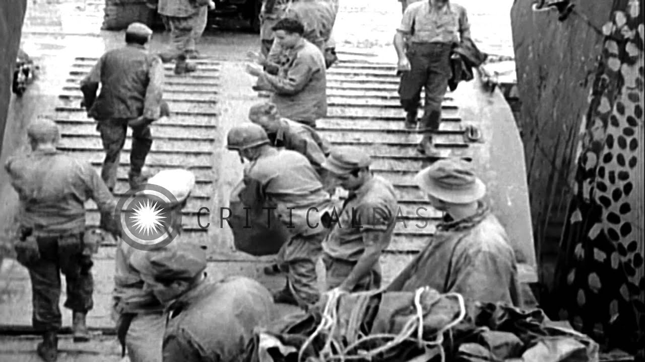 Soldiers aboard LCTs underway at sea in Okinawa, Japan during World War II. HD Stock Footage