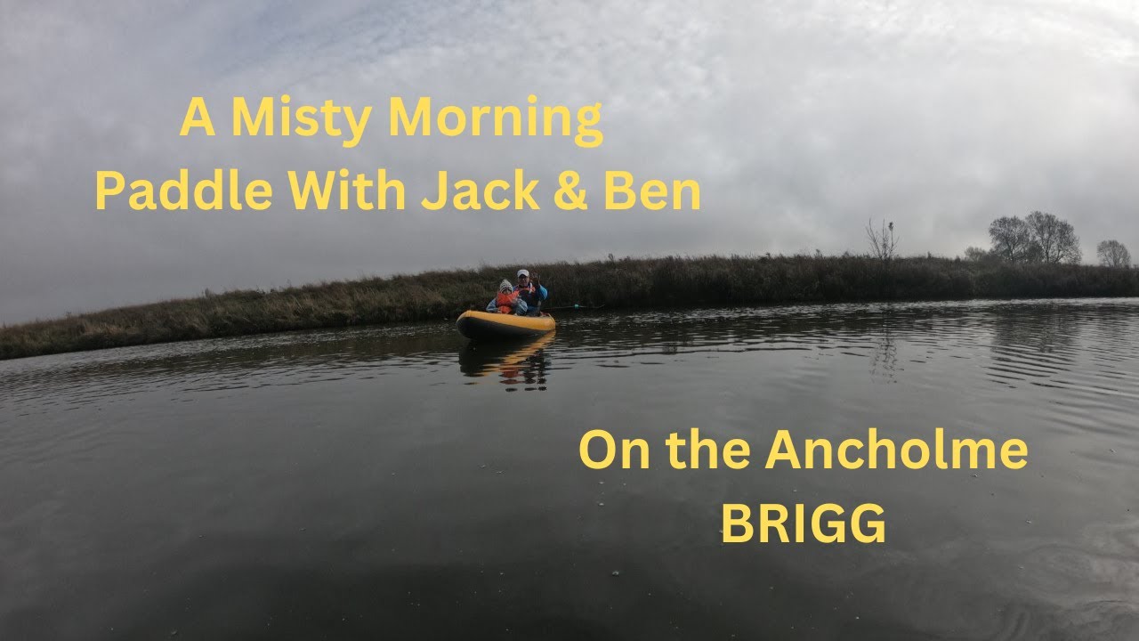 Enjoying a misty morning paddle with Ben and young Jack