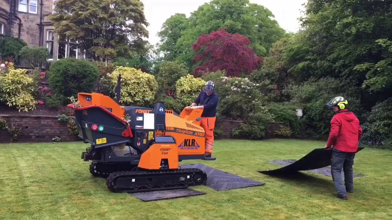 Scottish Arborists protect lawn before Tree surgery with tracked xr8 Forst wood chipper in Paisley