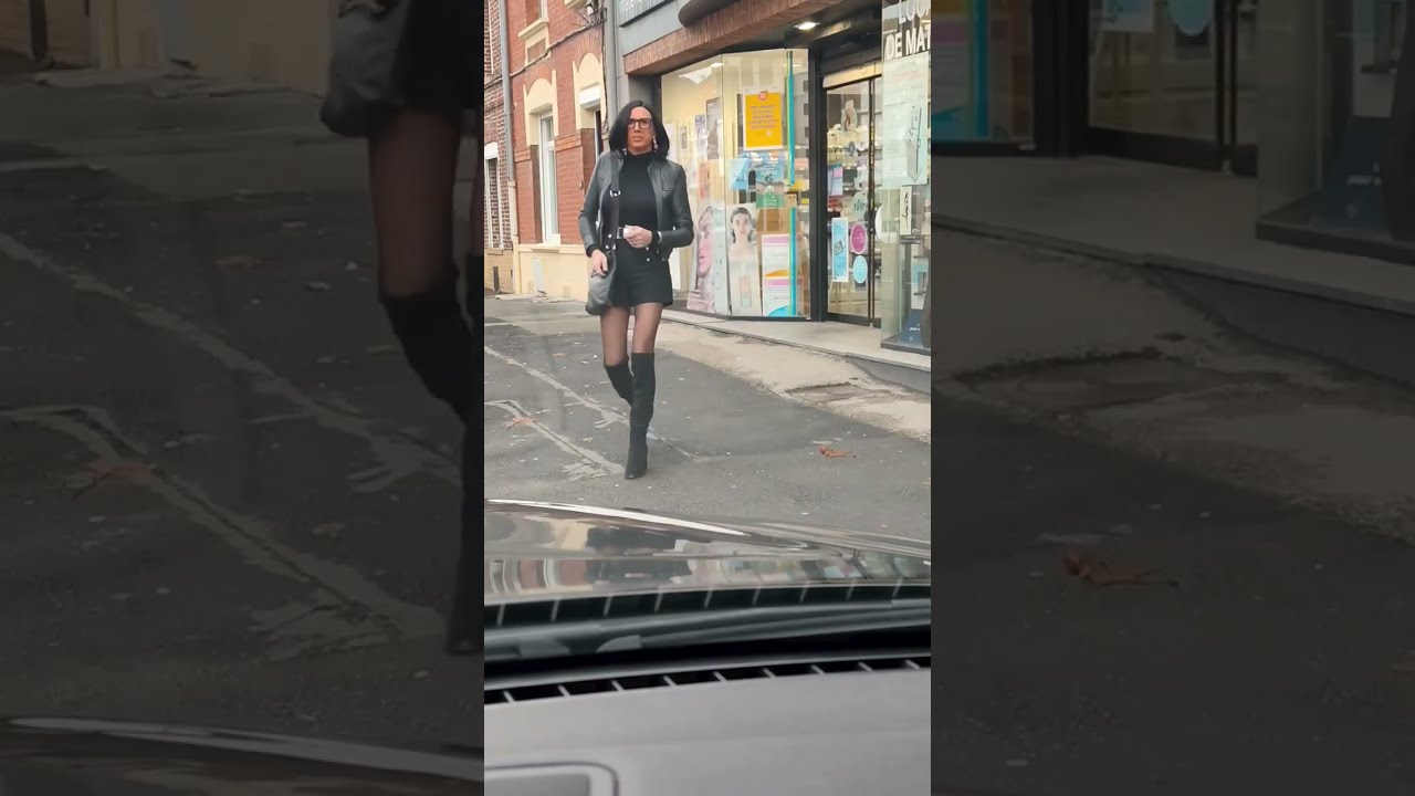 Crossdresser shopping in thigh high boots and black pantyhose 
