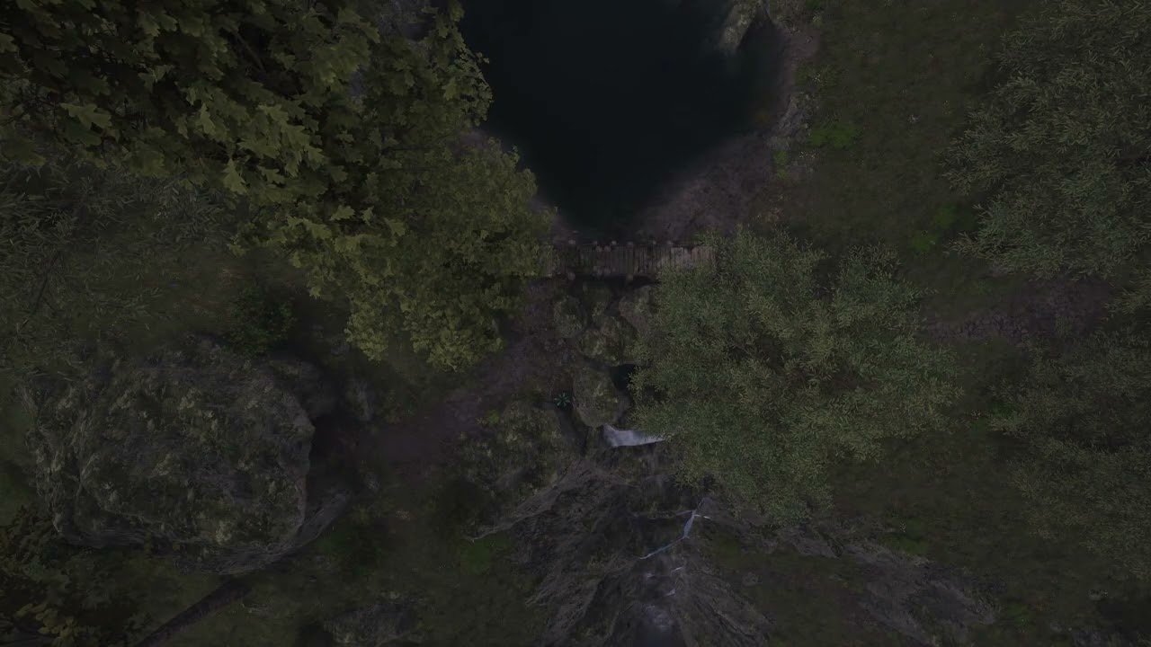 Cave Entrance near Lake and Waterfall