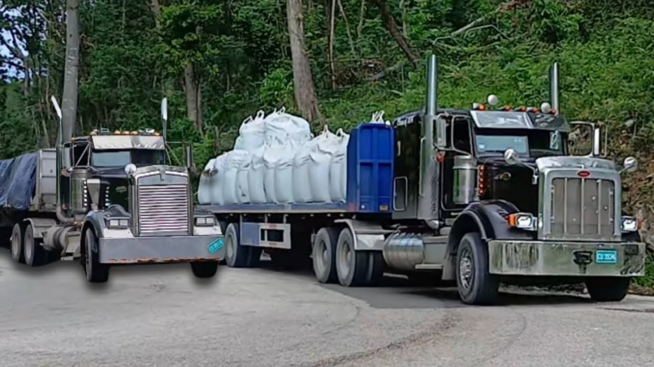 Trucks shifting & jake braking up and down a long hill loaded in St James