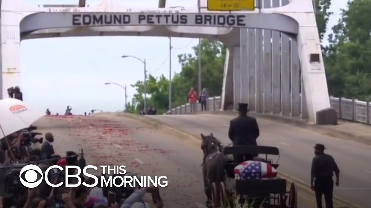 Civil rights icon Congressman John Lewis crosses Edmund Pettus Bridge one final time