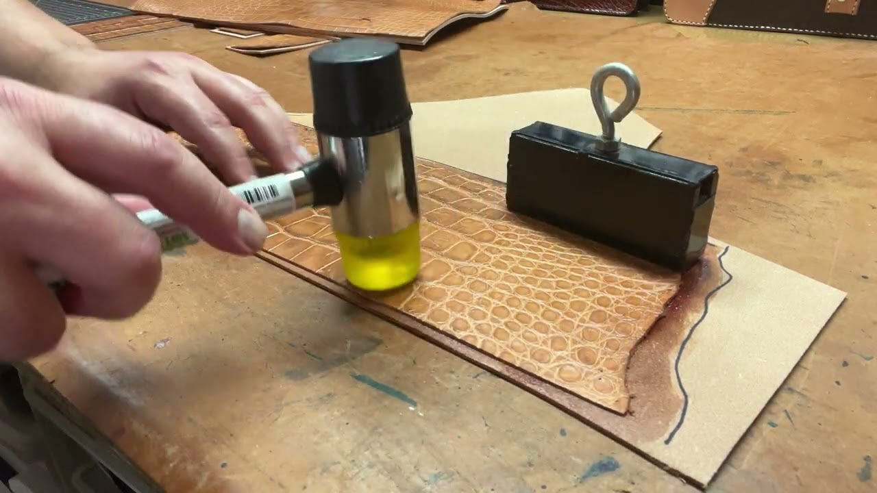 Gluing down alligator skin to natural tanned leather that will be it's lining.