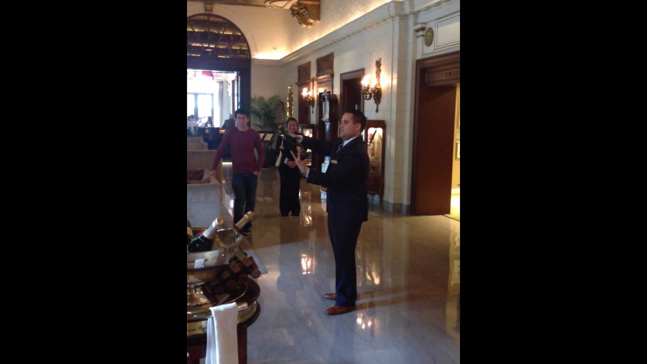 St. Regis Hotel, sabring a bottle of champagne