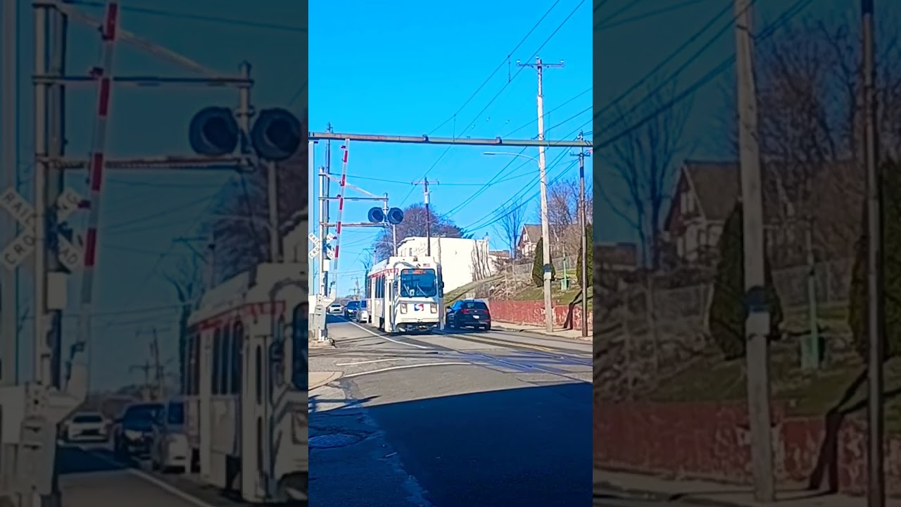 SEPTA Light Rail vehicle 9047 stopping to pick up passengers 