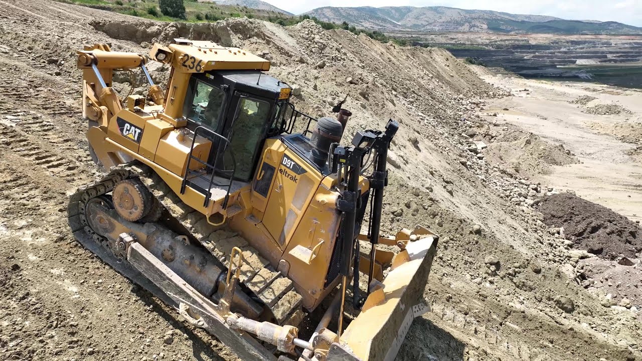 Caterpillar D9T Bulldozer Working On Huge Mining Area - Aerial View - 4k