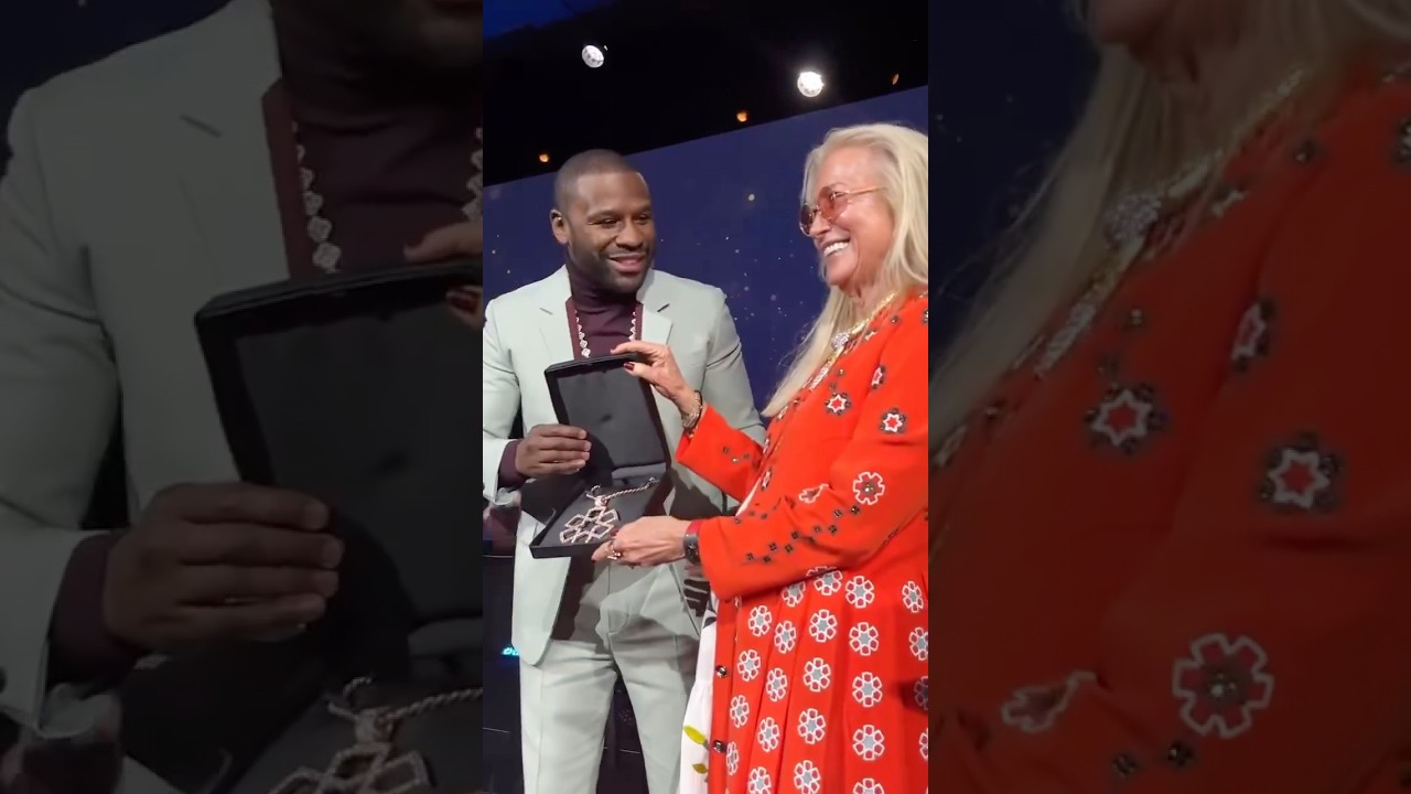 Floyd Mayweather presents Dr. Miriam Adelson with a custom Hatzalah diamond Necklace. 🧡