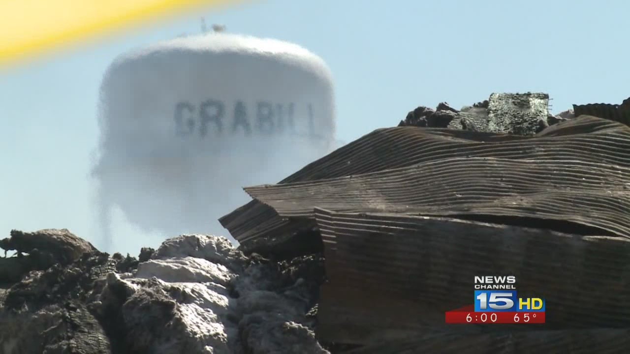 Rubble of old Grabill grain mill still smoldering