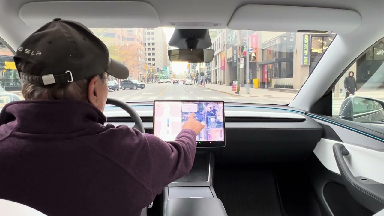 Showcasing Tesla FSD in downtown Toronto .