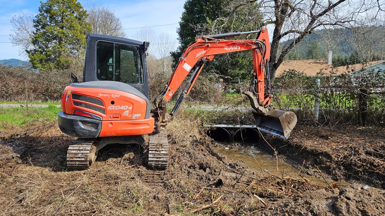 Farm ditch flowing free with the Kubota KX 040 4 excavator