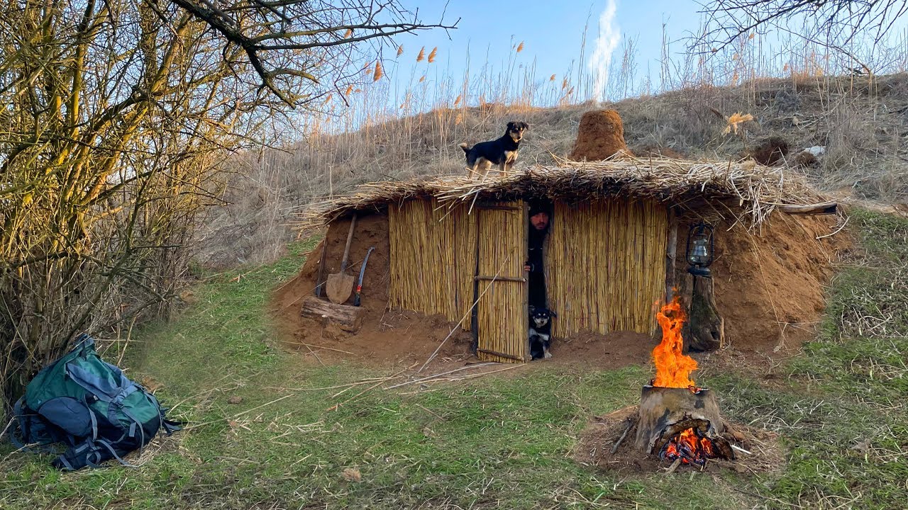 Building an earthen shelter in a clay mountain | Warm fireplace and reed roof