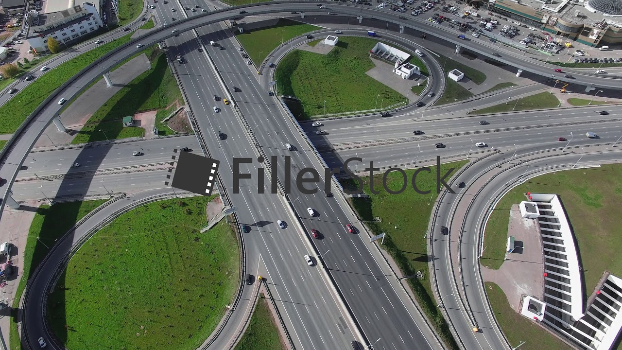 An aerial view of a ring road junction on a sunny day