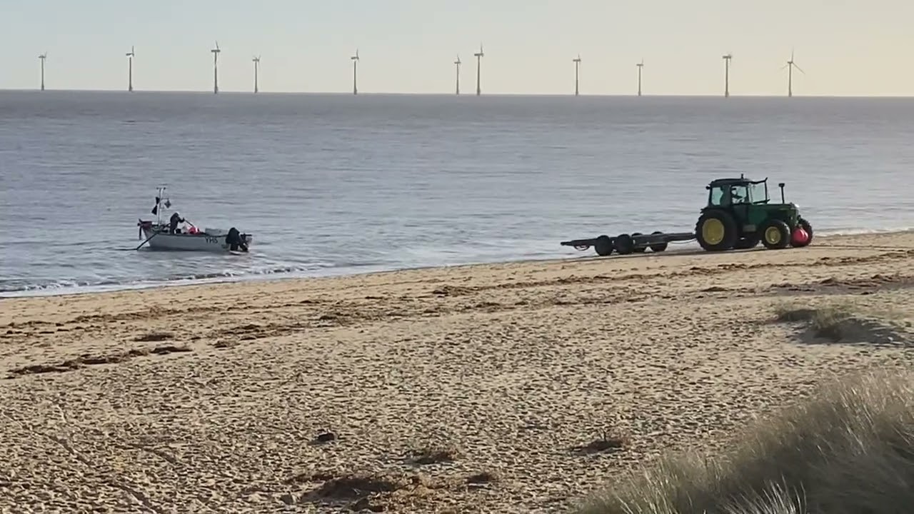 My father beach launching the boat for herring & sprats. Sea fishing Norfolk U.K. part 1