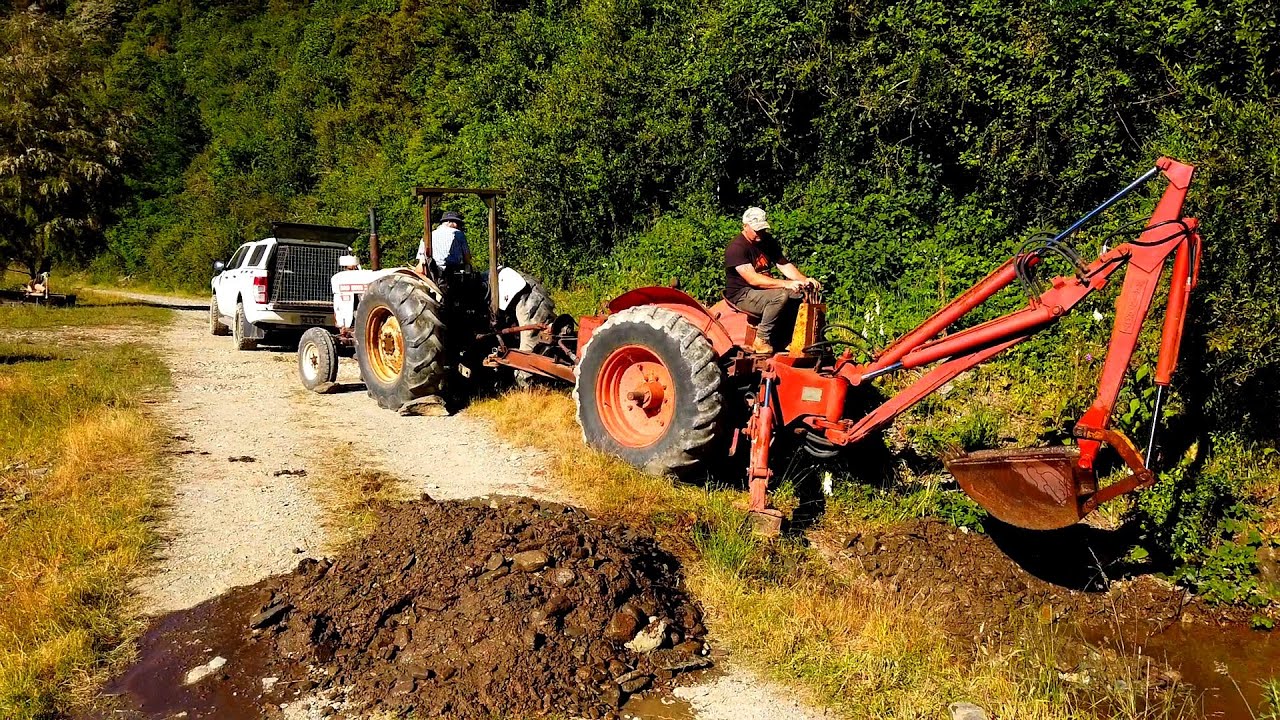 Homemade Backhoe and $500 David Brown Tractor clearing a culvert