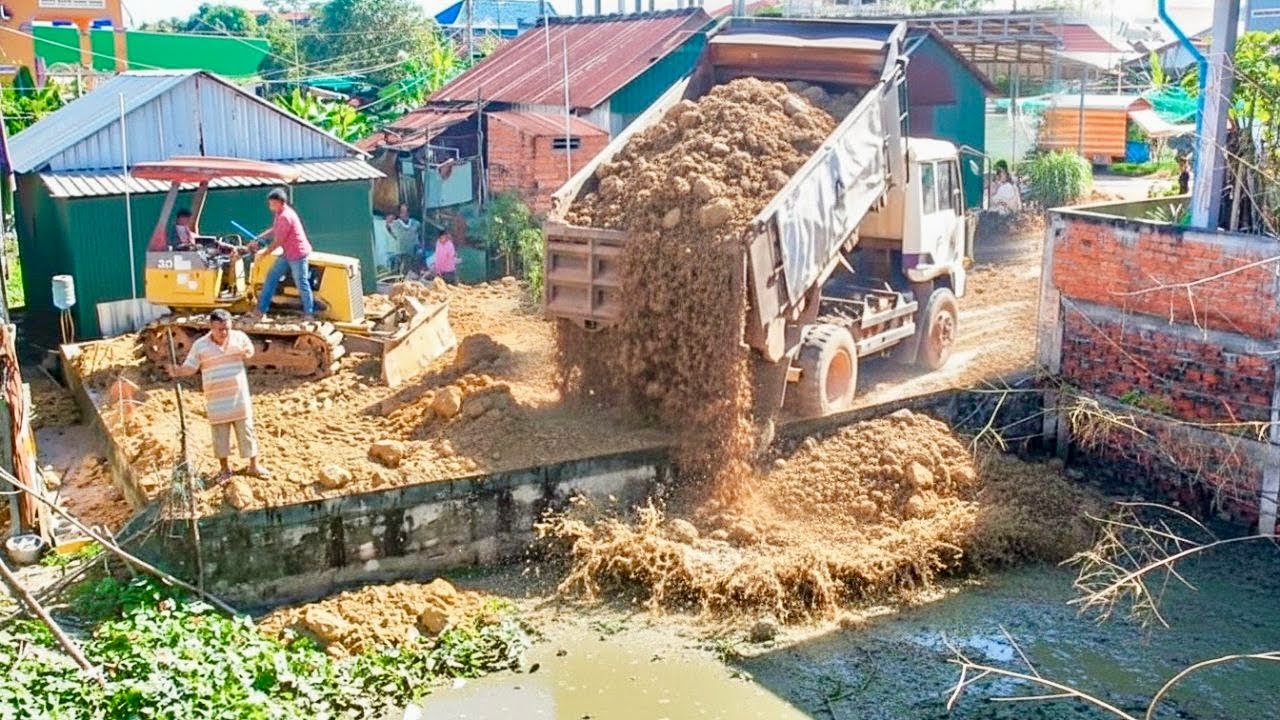 Start Opening New Project!! KOMAT'SU Bulldozer D20P pushing Soil into flooded​ Pond& Trucks 5Ton.