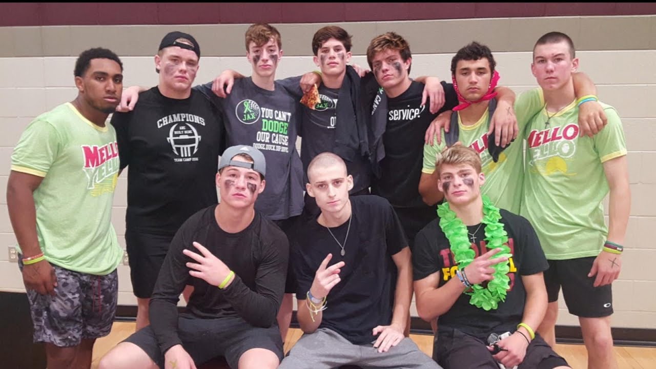 Teammates cheer on fellow high school football player who beat cancer