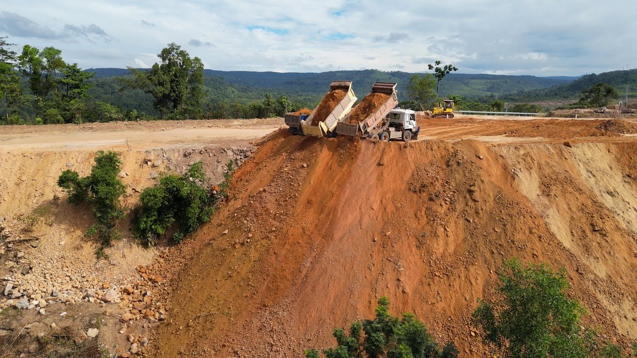 Perfect Skill 15T Truck Unloading Rocks and D37P Dozer Pushing Land Filling on the Mountain Project