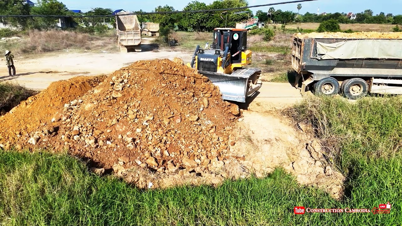 Best Bulldozer Shantui Pushing Soil With Hyundai Dump Trucks Dumping Soil Landfill Into Flood Land