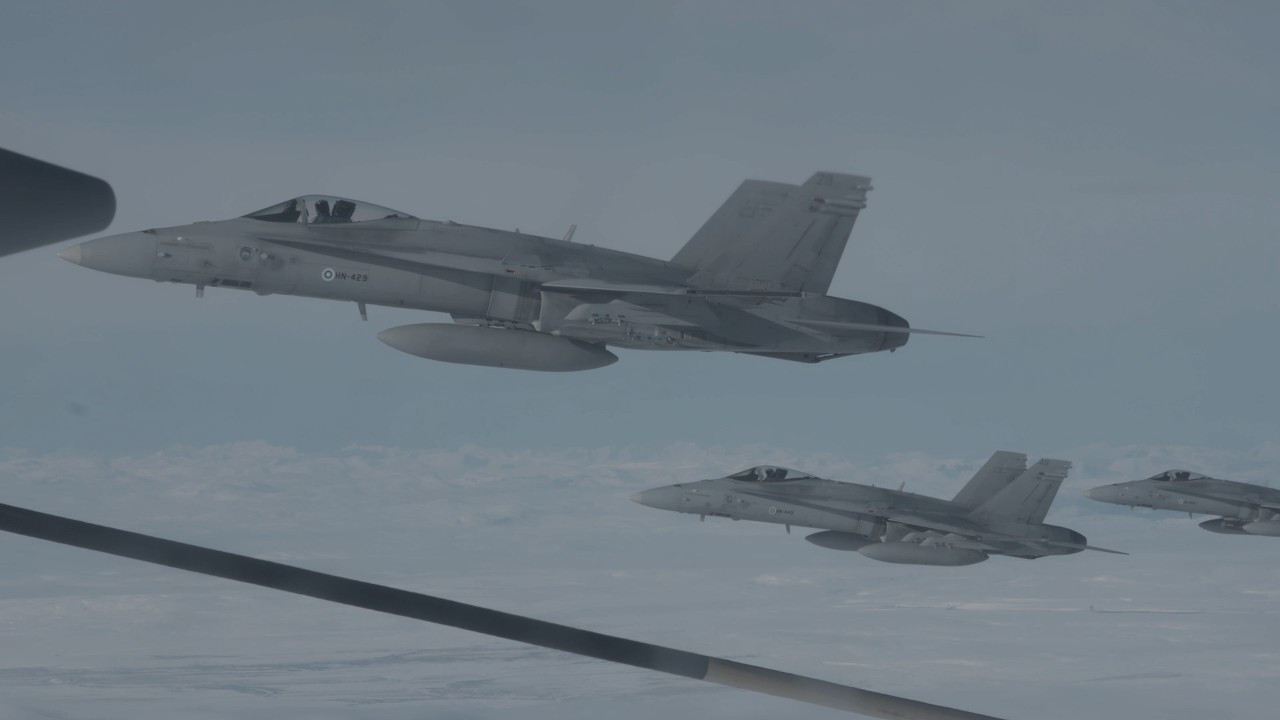 Marine KC-130J Super Hercules refuels Finnish Air Force F/A-18 Hornets