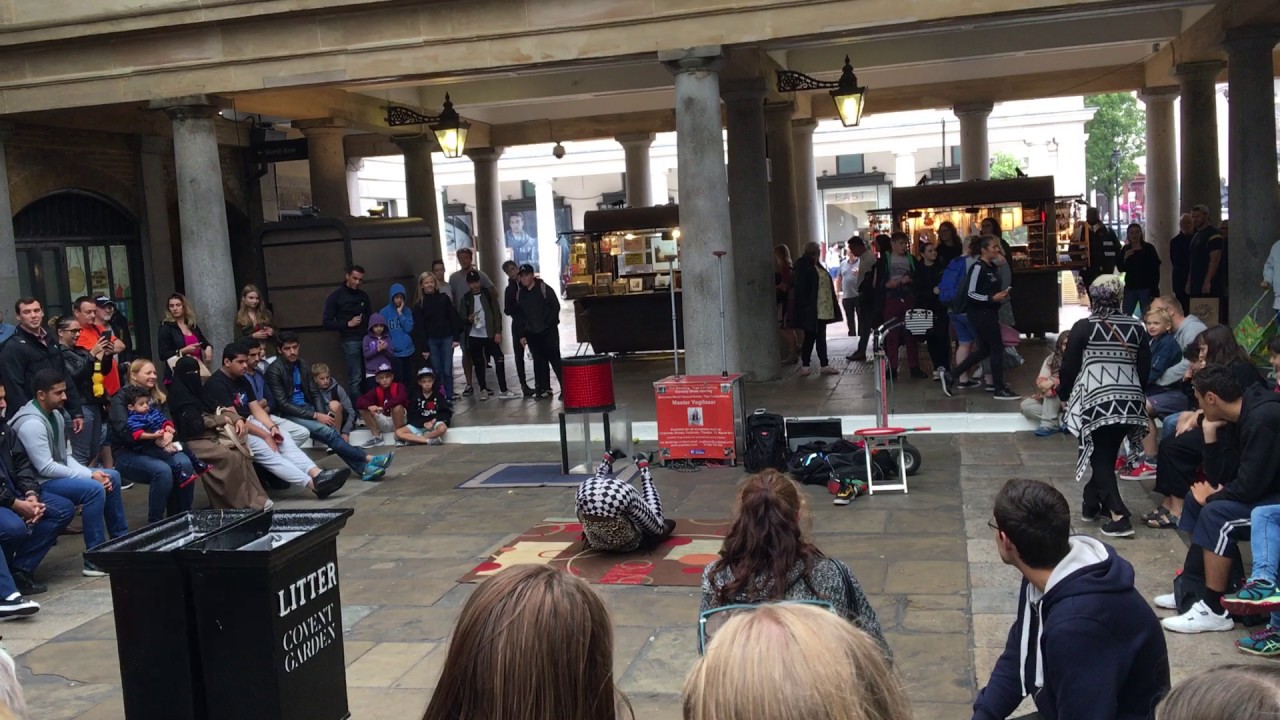 Extremely Flexible Man performing at Covent Garden, London.Street performance