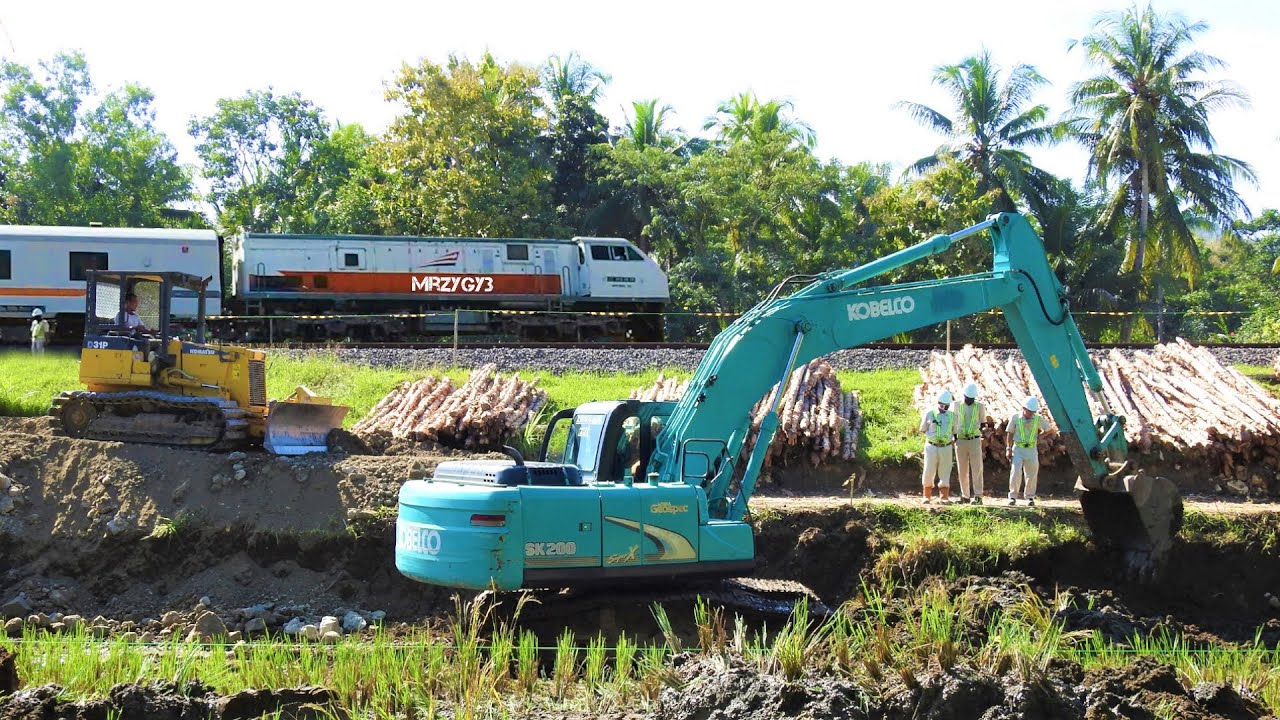 Excavator Dozer Dump Trucks Working On Train Station Construction Kobelco SK200
