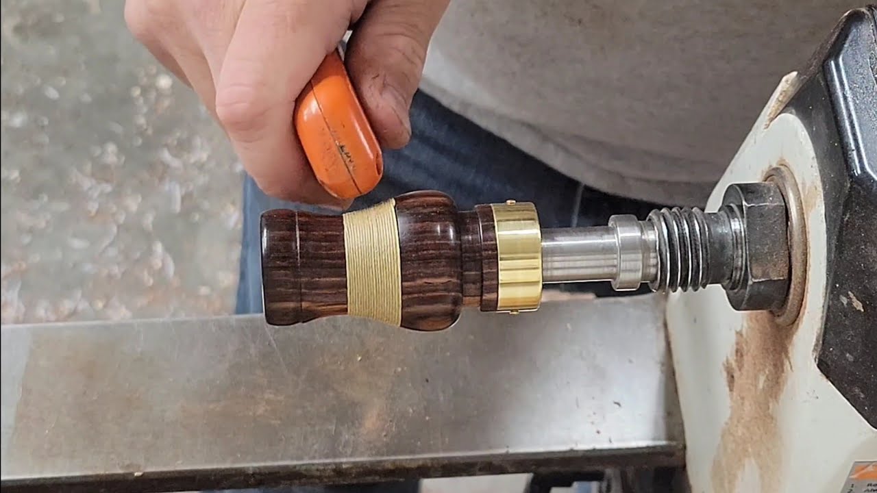 Wood turning a cord wrapped cocobolo duck call barrel on a lathe