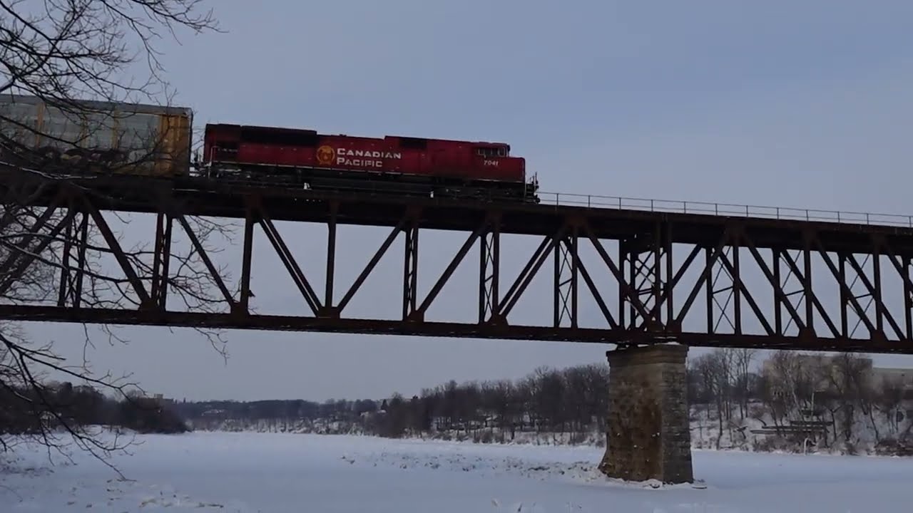 Jan 27 2026 CPKC 230 eastbound with mid train DPU going over the Grand river on the Galt sub