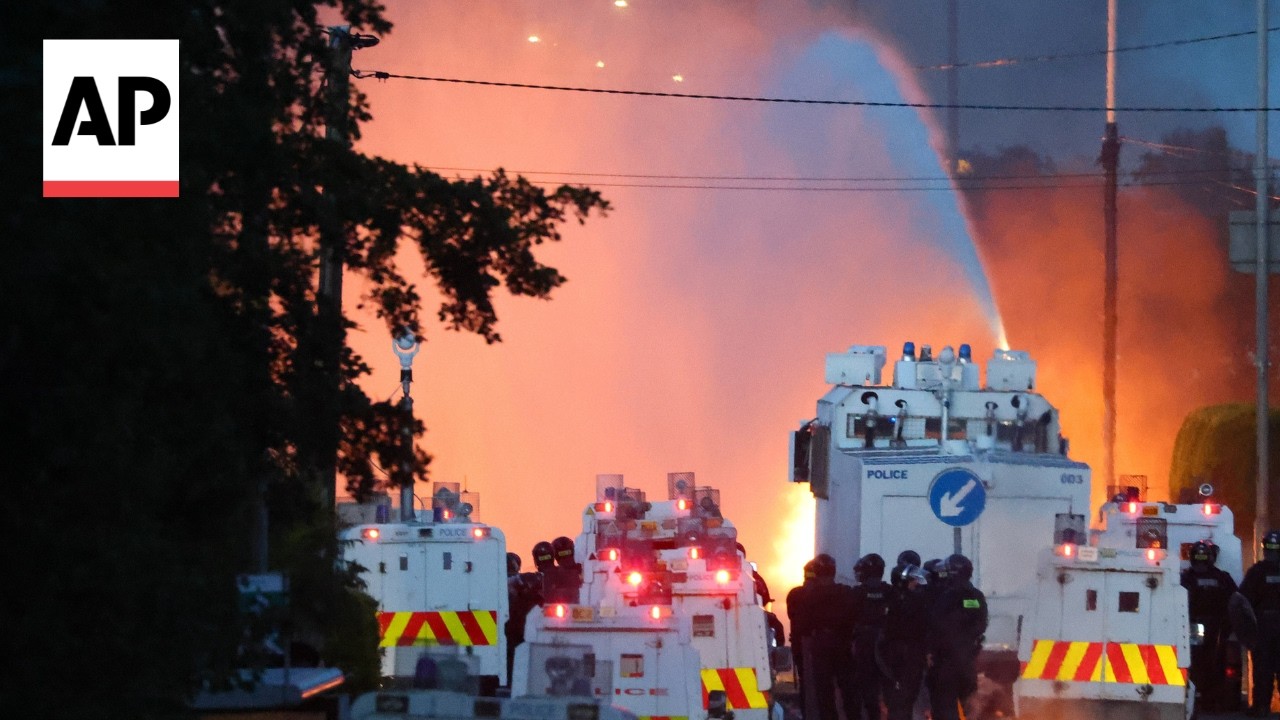 Police blast water cannons at Belfast protesters as unrest flares again after stabbing