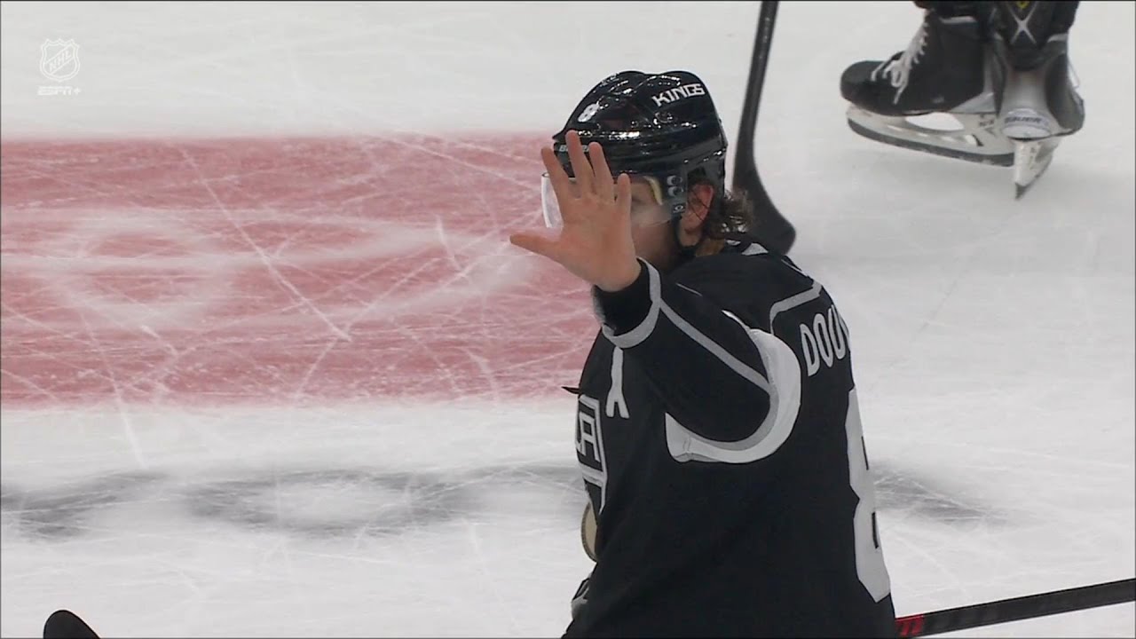 Kirill Kaprizov gets ejected from the game for hitting Drew Doughty in the face.