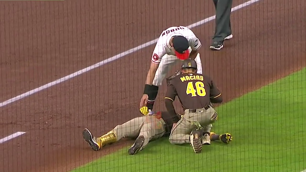Luis Arraez collides with Mauricio Dubon and is down on the field.