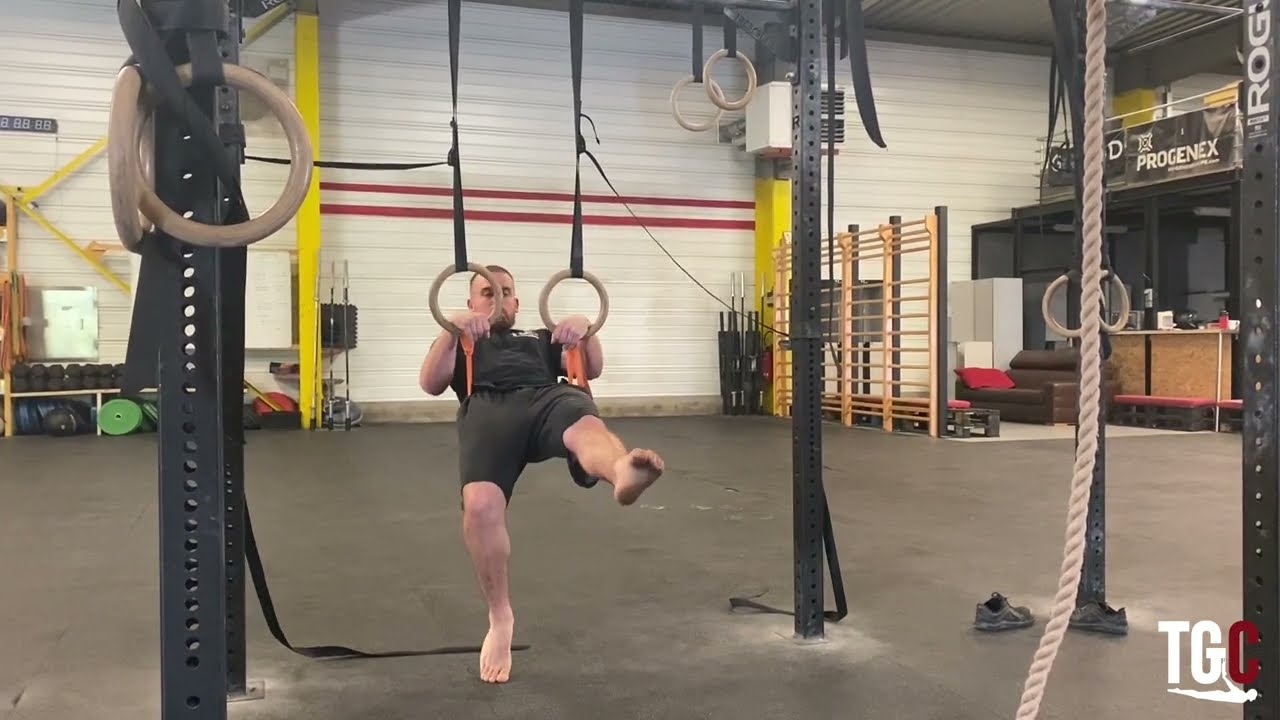 Top of front lever with band on rings  : Gymnastics Programming