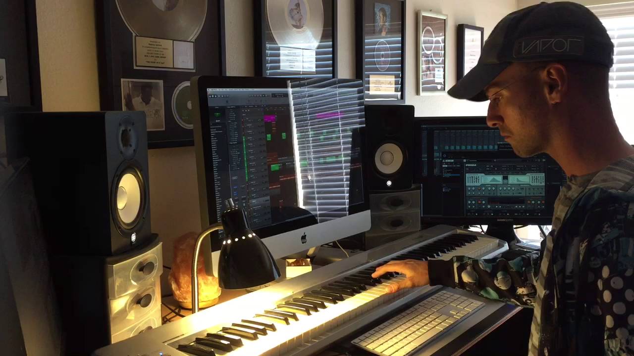 producing a hip hop beat for an independent artist in the studio
