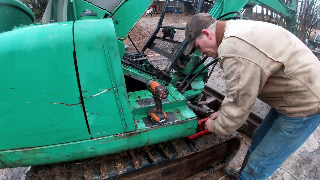 Working on a Takeuchi TB025 excavator