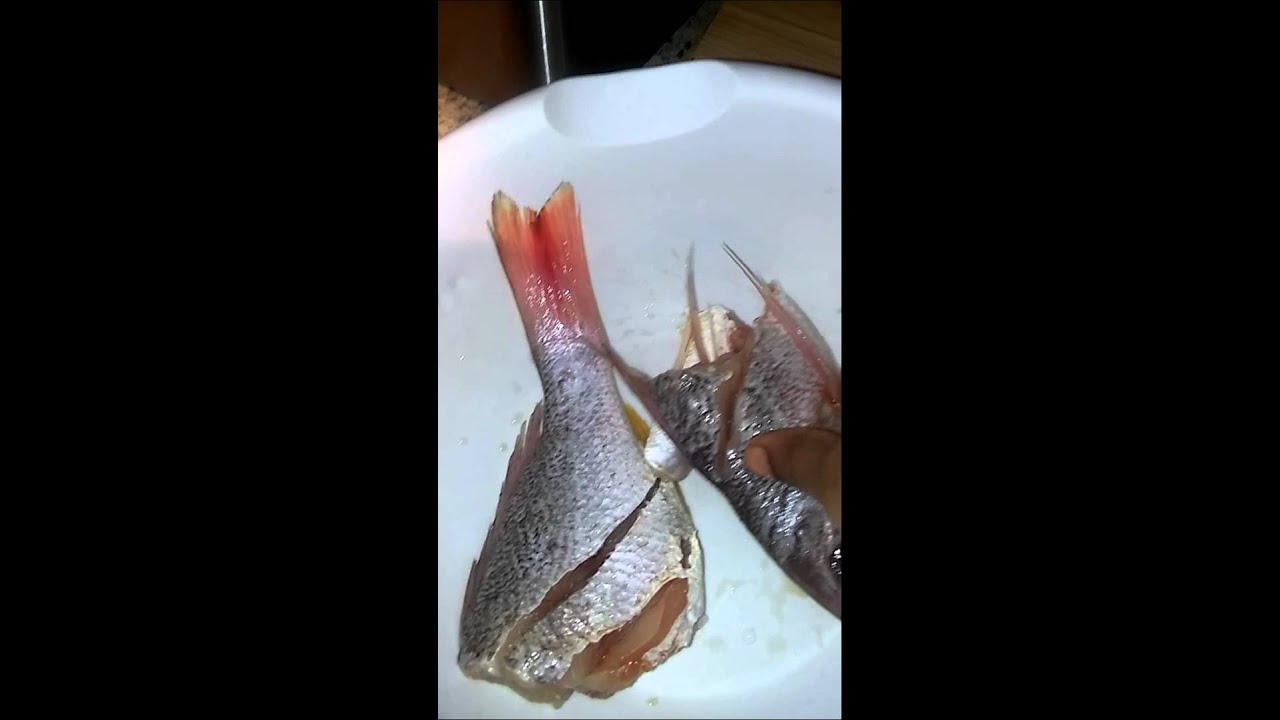 How to clean Haitian fish.