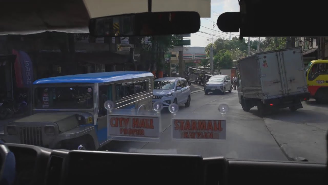 Philippines, modern Jeep front seat ride from Starmall to Dulon Bayan Toda terminal