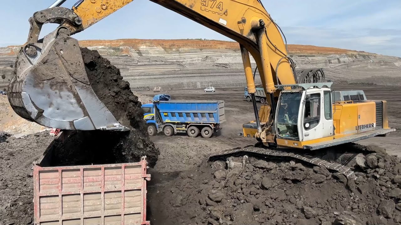 Liebherr 974 Excavator Loading Trucks
