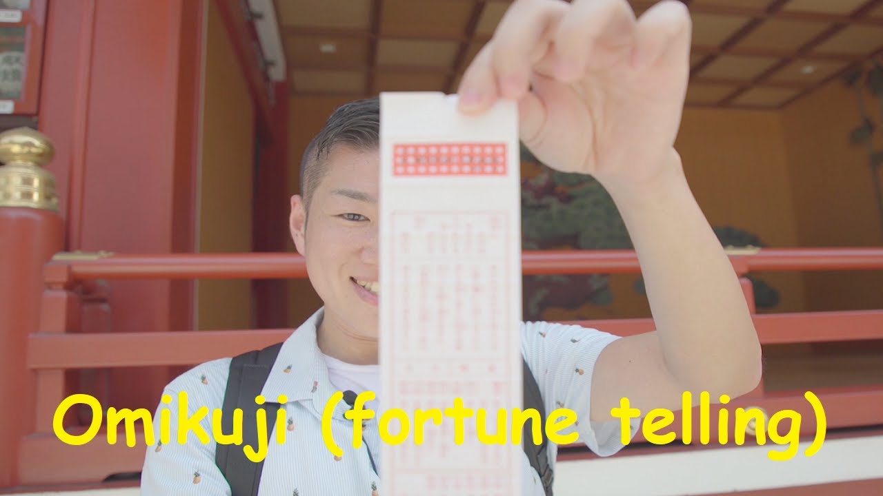 Omikuji (written oracle / written divination / fortune telling) at the shrine in Japan おみくじ