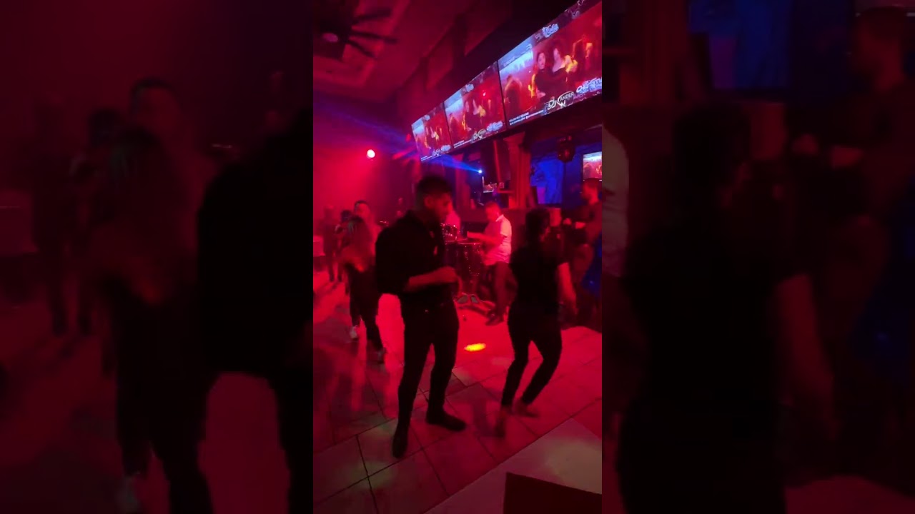 Wander Rosario and Nancy Vazques dancing at Alamir Addison Tx