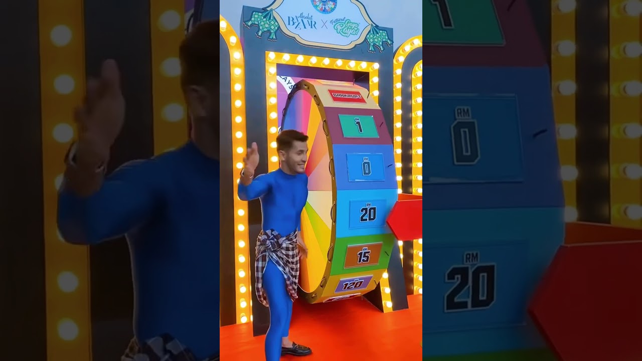 Alif Syukri Terlajak Laris try Absolut Bazaar x Gaya Raya Wheel of Fortune game.
