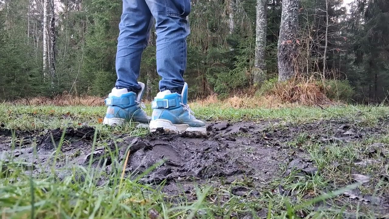 Platform sneakers playing in mud, soles slip and get stuck. 