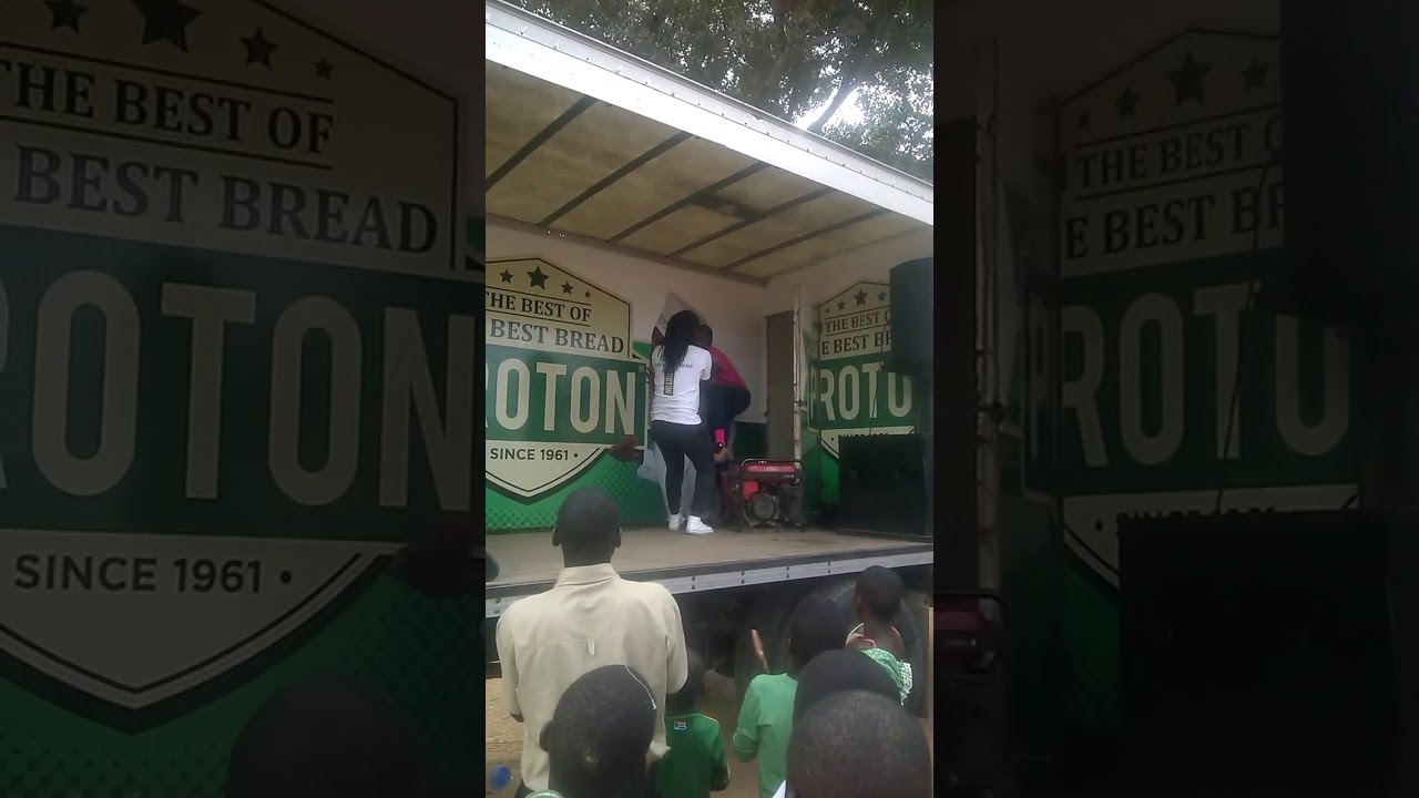 MC Ba Sunshine and friends dances on a Proton Roadshow in Zimbabwe.