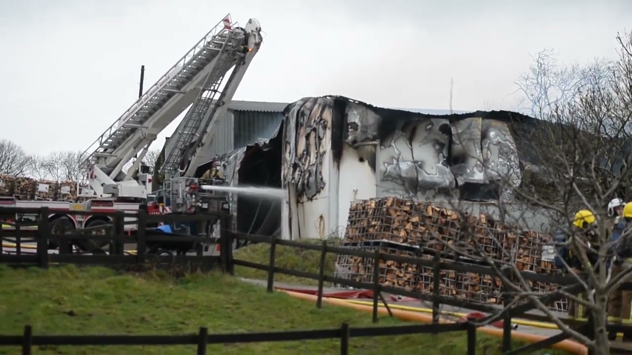 Blaze and explosions leave barn badly damaged